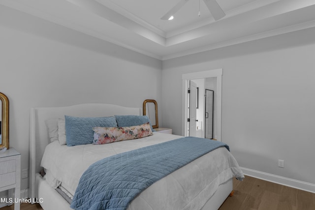 118 Seymour Dr, Madison, MS 39110 - bedroom featuring wood finished floors, baseboards, recessed lighting, ornamental molding, and a tray ceiling