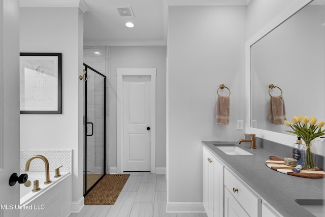 118 Seymour Dr, Madison, MS 39110 - bathroom with a stall shower, a garden tub, double vanity, recessed lighting, and baseboards