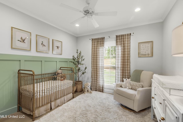 118 Seymour Dr, Madison, MS 39110 - bedroom with a crib, a decorative wall, a ceiling fan, recessed lighting, and crown molding