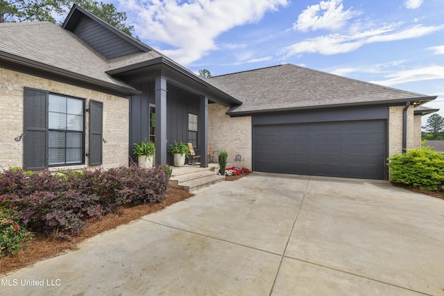 118 Seymour Dr, Madison, MS 39110 - view of front of home featuring roof with shingles, an attached garage, concrete driveway, and brick siding