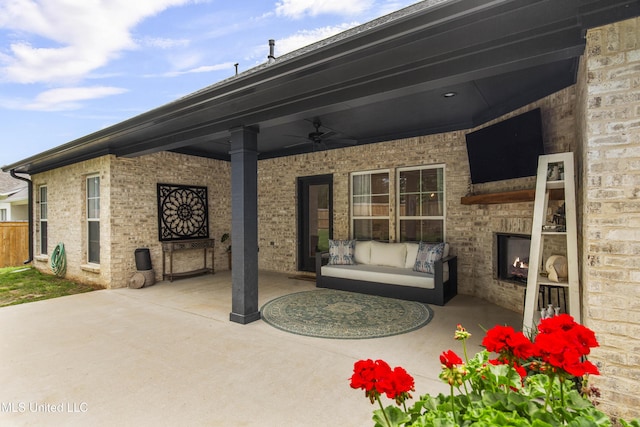 118 Seymour Dr, Madison, MS 39110 - view of patio featuring ceiling fan, an outdoor living space with a fireplace, and fence