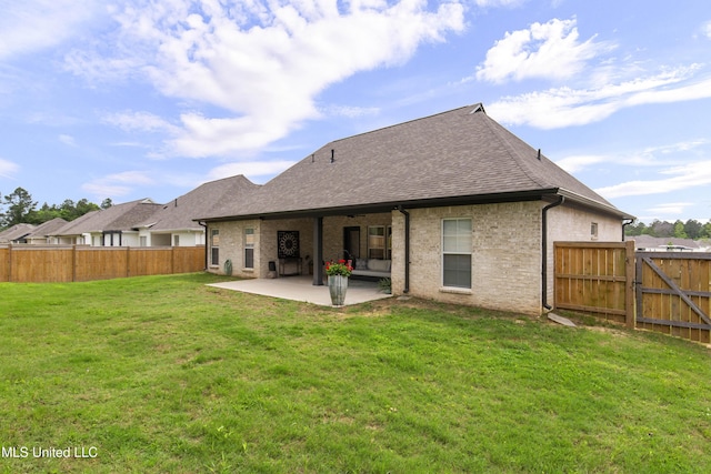 118 Seymour Dr, Madison, MS 39110 - back of house with a patio, roof with shingles, and brick siding