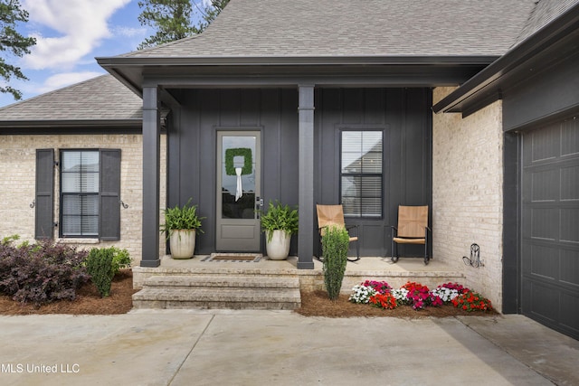 118 Seymour Dr, Madison, MS 39110 - doorway to property featuring roof with shingles, brick siding, and an attached garage