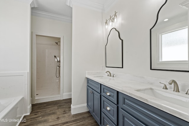 bathroom with vanity, hardwood / wood-style floors, separate shower and tub, and ornamental molding