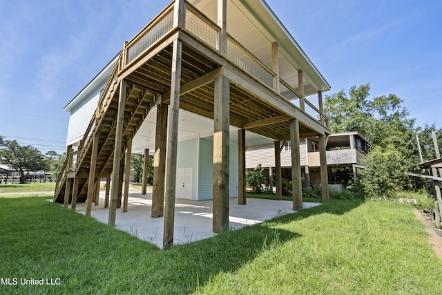 view of community featuring a patio area, a deck, and a lawn