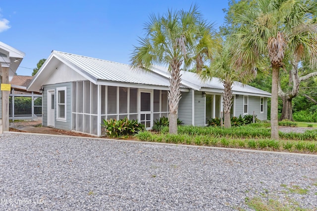 view of front of home with a sunroom