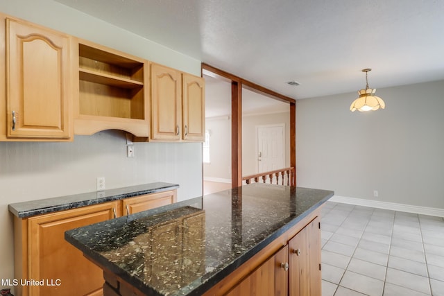 2802 Ridgewood Ave, Pascagoula, MS 39567 - kitchen with a kitchen island, open shelves, dark stone countertops, pendant lighting, and light brown cabinets