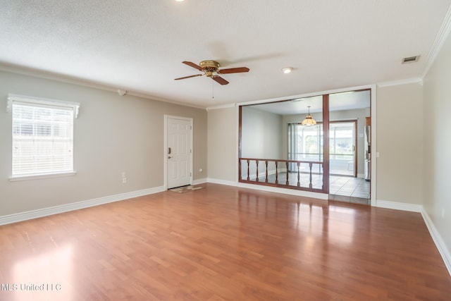 2802 Ridgewood Ave, Pascagoula, MS 39567 - unfurnished room featuring ceiling fan, wood finished floors, ornamental molding, and baseboards