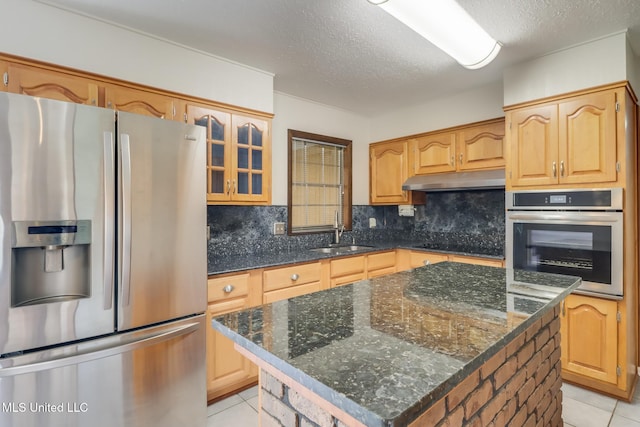 2802 Ridgewood Ave, Pascagoula, MS 39567 - kitchen with appliances with stainless steel finishes, a sink, light tile patterned floors, decorative backsplash, and a textured ceiling