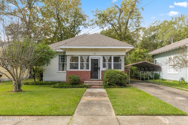 bungalow-style home with a front lawn and a carport