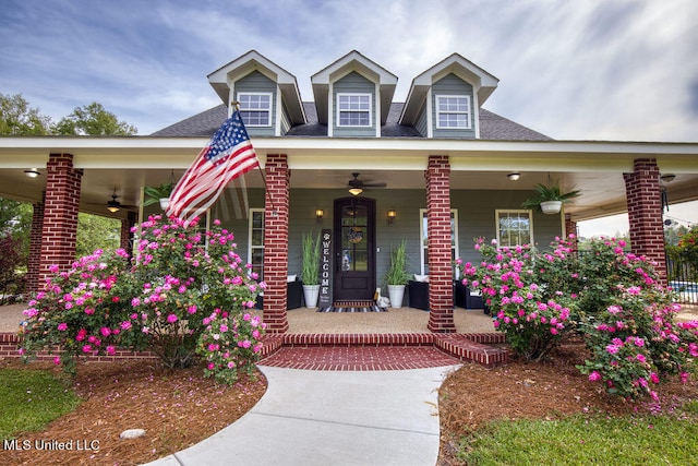 cape cod house with covered porch and ceiling fan