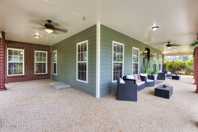 view of patio with outdoor lounge area and ceiling fan