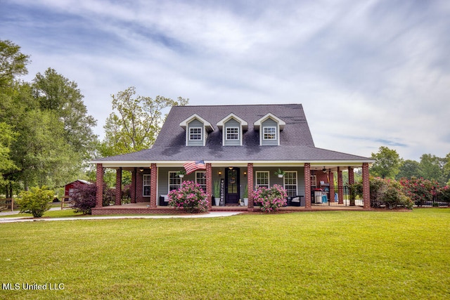 view of front of house with a porch and a front yard