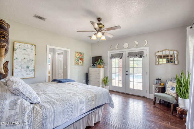 bedroom featuring ceiling fan, dark hardwood / wood-style floors, a textured ceiling, french doors, and access to outside