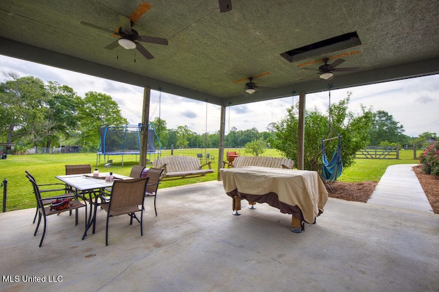 view of patio featuring ceiling fan and a trampoline