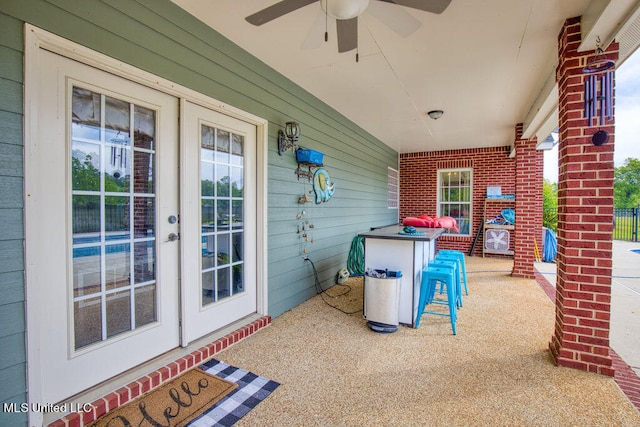 view of patio featuring ceiling fan