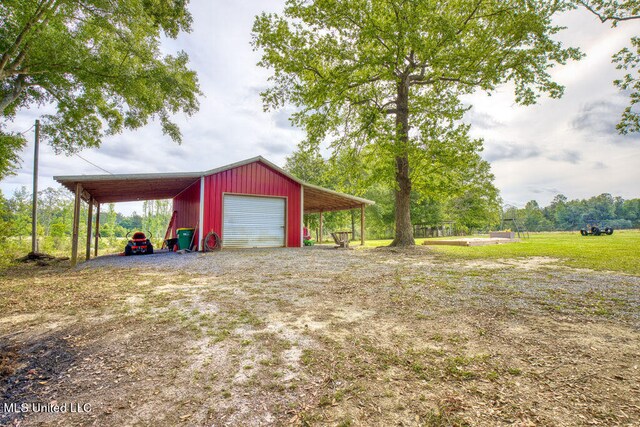 garage featuring a carport