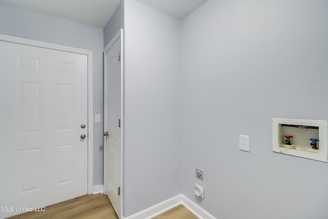 laundry area featuring hookup for an electric dryer, hookup for a washing machine, and light wood-type flooring