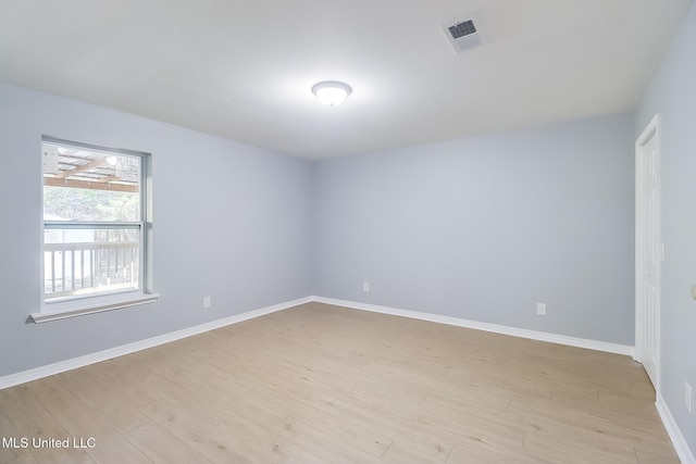 unfurnished room with light hardwood / wood-style flooring