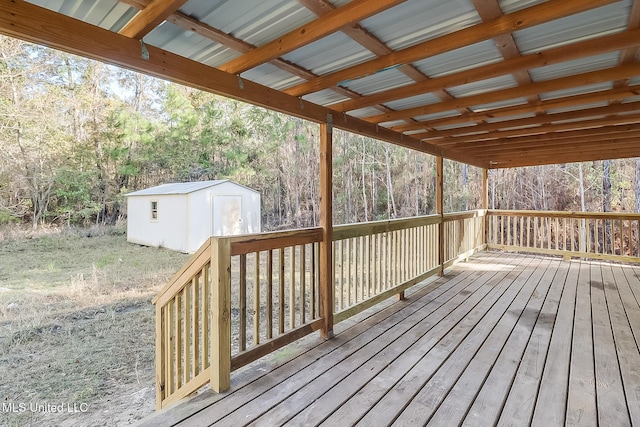 wooden terrace with a storage shed