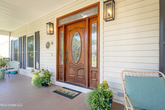 property entrance with covered porch