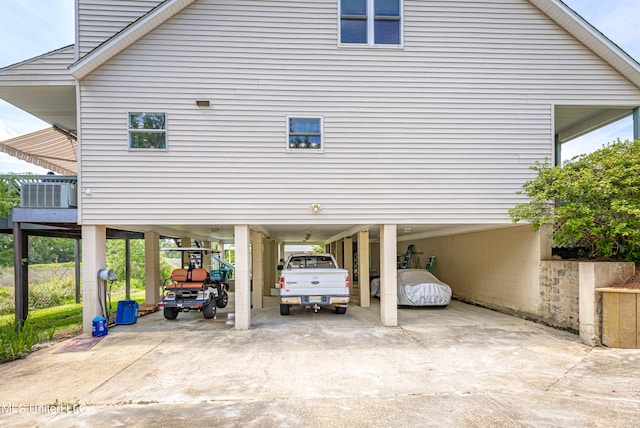 view of vehicle parking featuring a carport