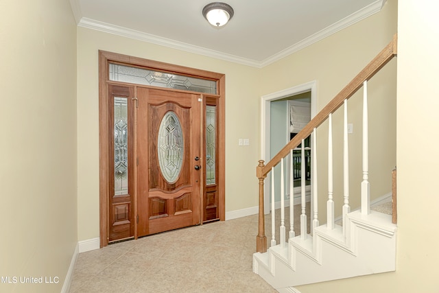 tiled foyer entrance with crown molding