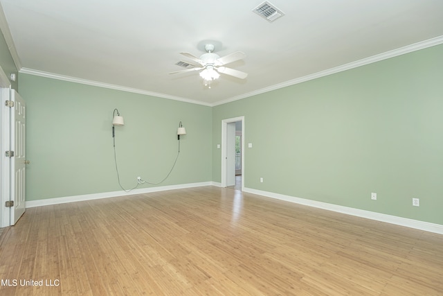 unfurnished room featuring ornamental molding, light wood-type flooring, and ceiling fan