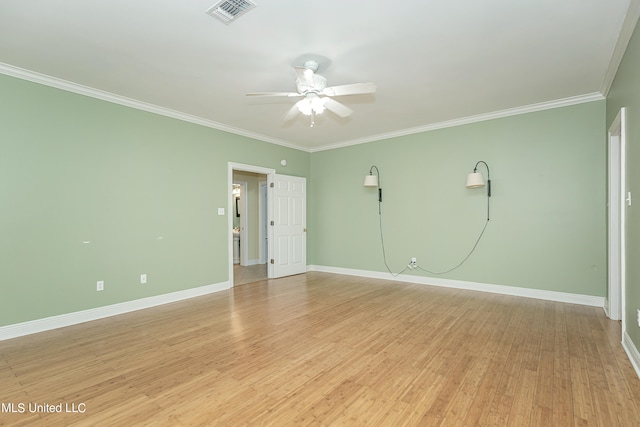 spare room featuring light hardwood / wood-style floors, crown molding, and ceiling fan