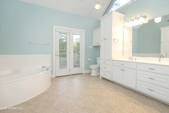 bathroom featuring vanity, toilet, lofted ceiling, and tile patterned flooring