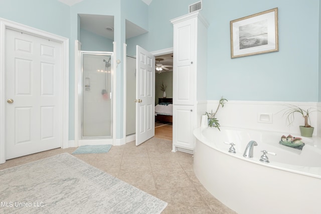 bathroom featuring separate shower and tub, ceiling fan, lofted ceiling, and tile patterned floors