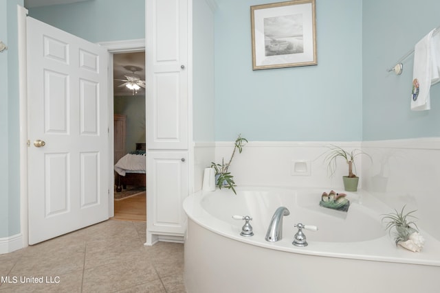 bathroom featuring a tub, tile patterned flooring, and ceiling fan