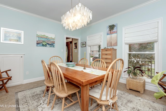 tiled dining room featuring crown molding and a chandelier