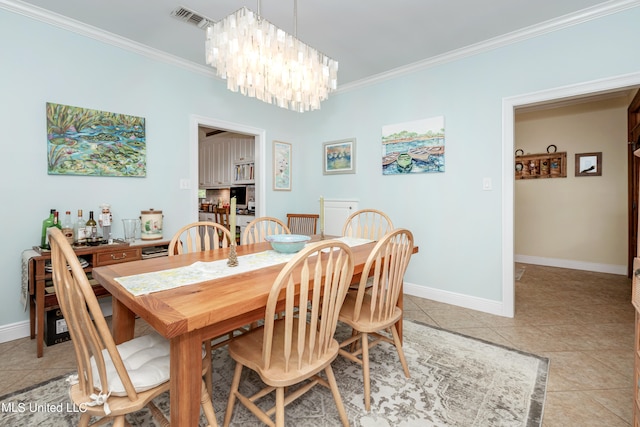 dining room with ornamental molding, a chandelier, and light tile patterned flooring