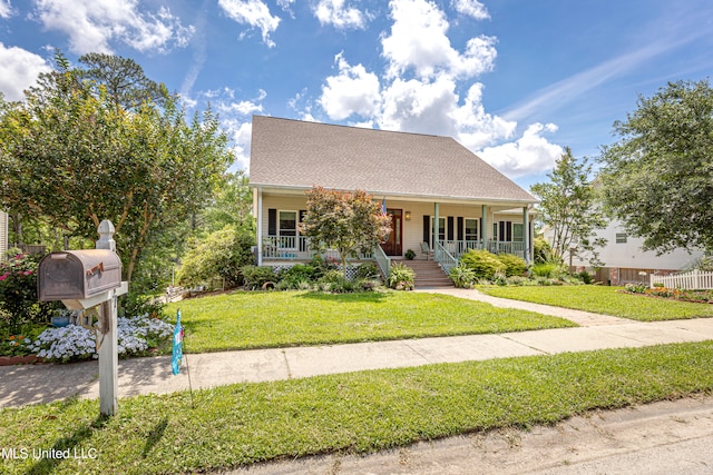 view of front of home featuring a front yard and a porch