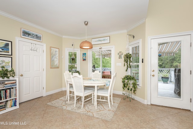 tiled dining space with crown molding, plenty of natural light, and ceiling fan