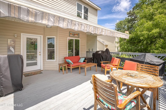 wooden deck featuring area for grilling