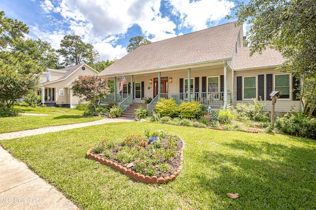 view of front of property with covered porch and a front lawn