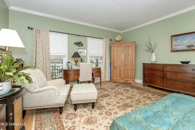 living area featuring ornamental molding and light wood-type flooring