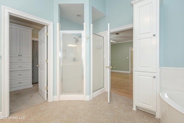 bathroom featuring ornamental molding, shower with separate bathtub, and tile patterned floors