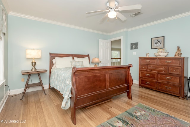 bedroom with ceiling fan, crown molding, and light hardwood / wood-style flooring