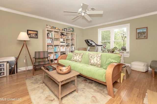 living room with ceiling fan, hardwood / wood-style flooring, and ornamental molding