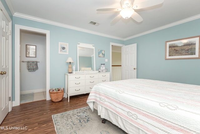 bedroom with ornamental molding, dark wood-type flooring, and ceiling fan