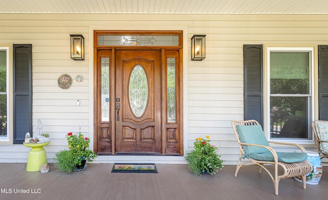 doorway to property featuring covered porch