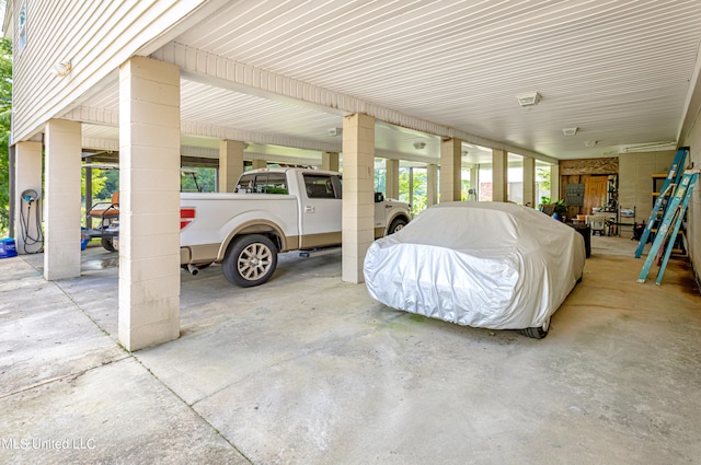 garage featuring a carport