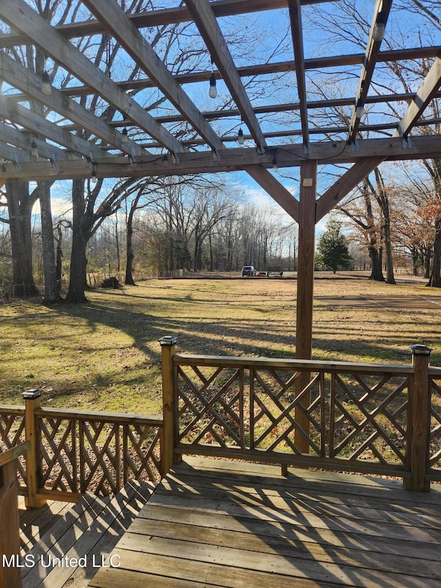 wooden terrace with a yard