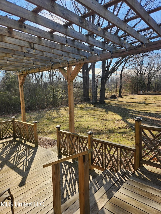 wooden terrace with a lawn and a pergola