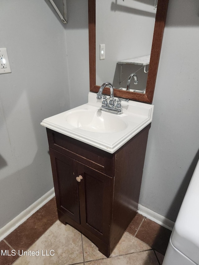 bathroom with vanity and tile patterned flooring