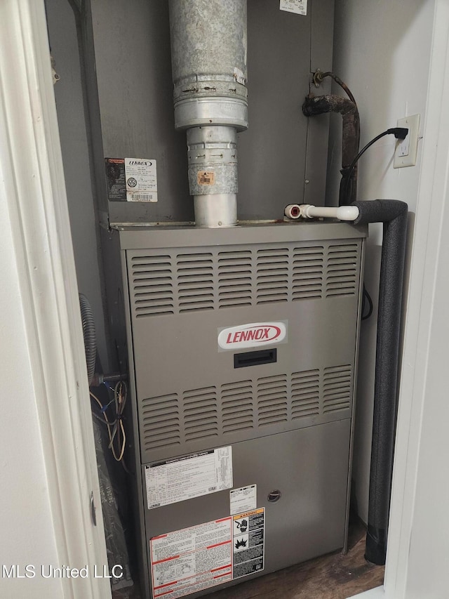 utility room with heating unit