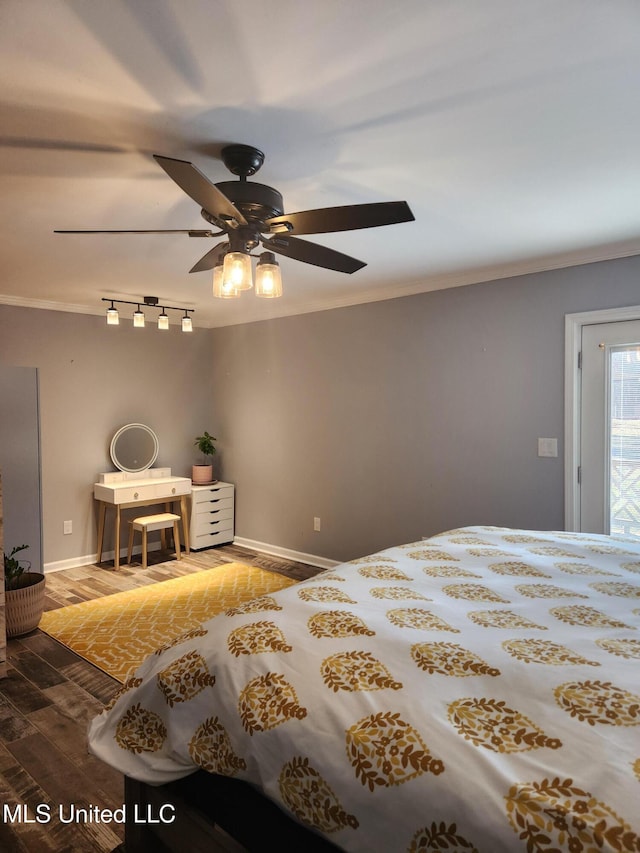 bedroom with hardwood / wood-style flooring, crown molding, and ceiling fan